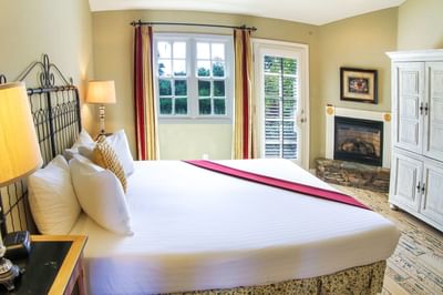 Deluxe Suite at Cambria Pines Lodge with fireplace