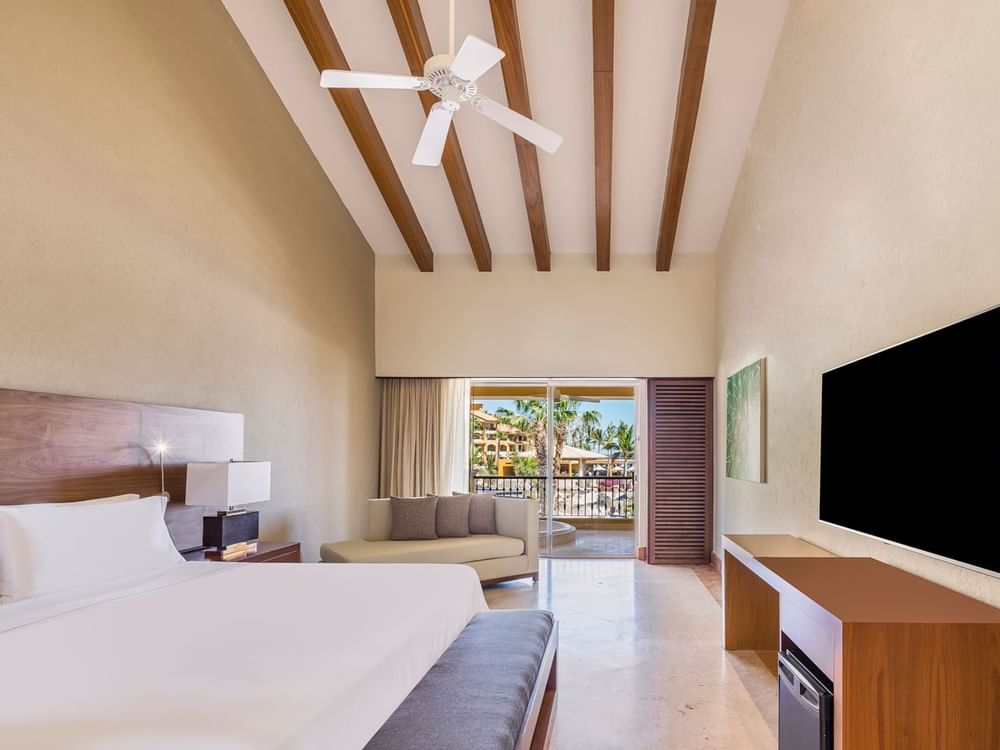 Bed & furniture in Governor Suite at Grand Fiesta Americana
