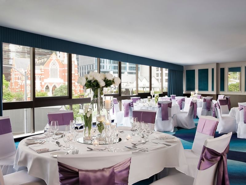 Banquet tables arranged with a city view in a Wedding venue at Pullman King George Square