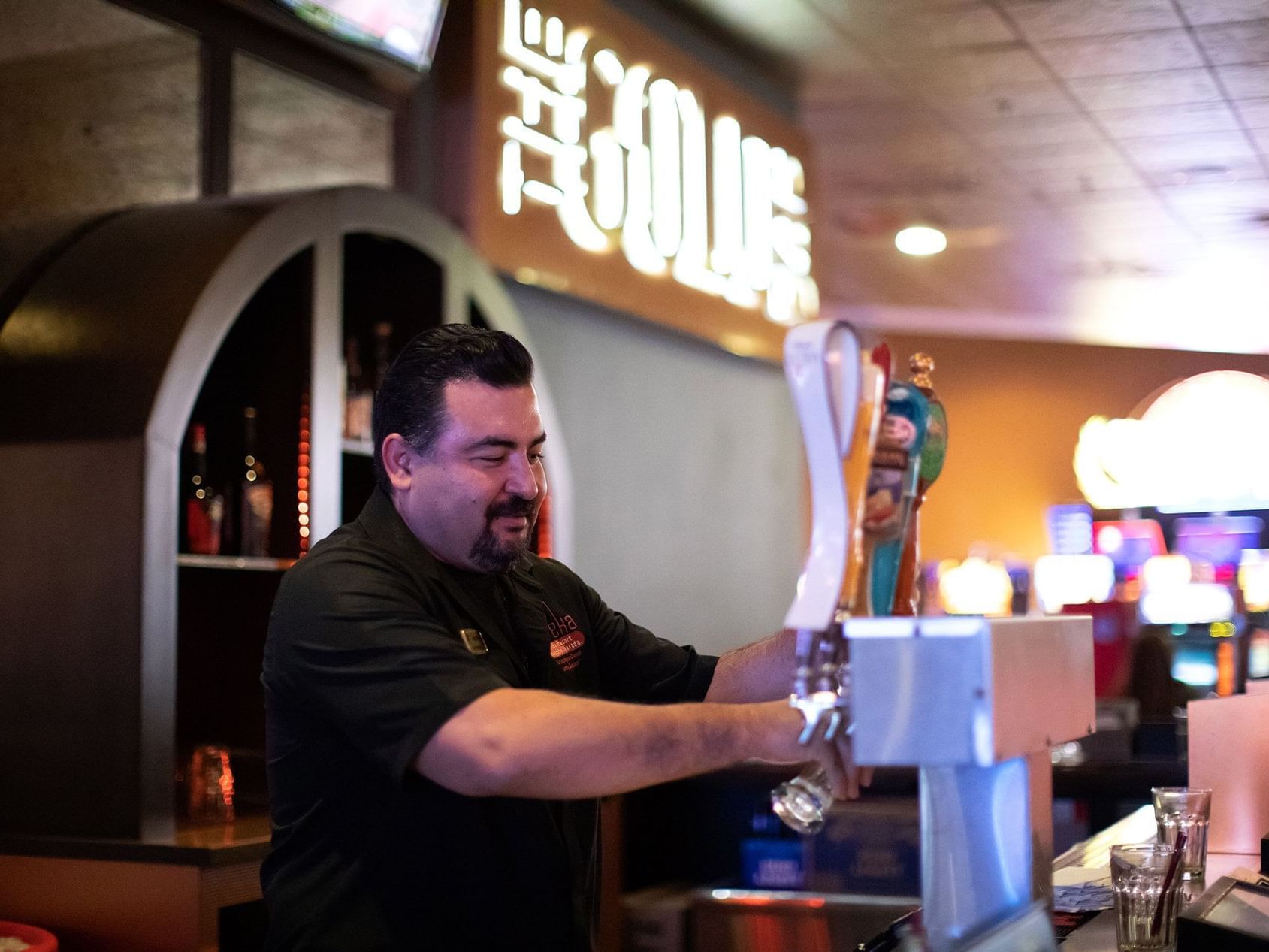 man pouring beer