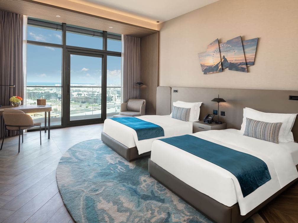 Twin beds with headboard by the balcony view in Scene Room Duet at Paramount Hotel Midtown