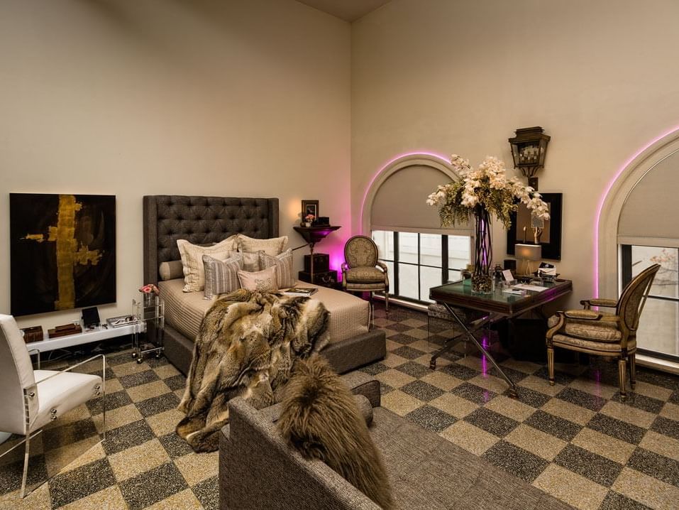 Wide angle image of a bedroom in a Residence at The Mayo Hotel