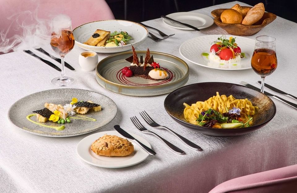 Modern European dining at Tablescape, Grand Park City Hall, with artisanal courses and wine in a luxury neoclassical setting.