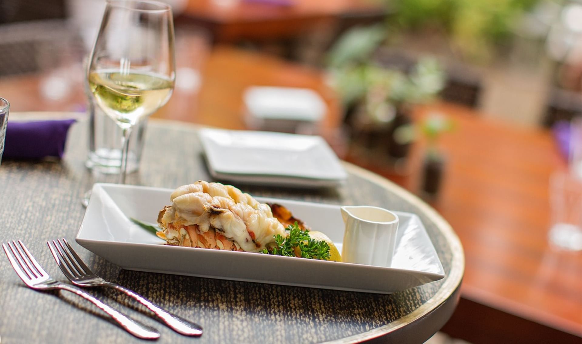 Lobster dish with wine served at Maui Coast Hotel