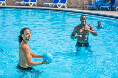 Men playing with a ball in the pool at Holiday Inn Montego Bay