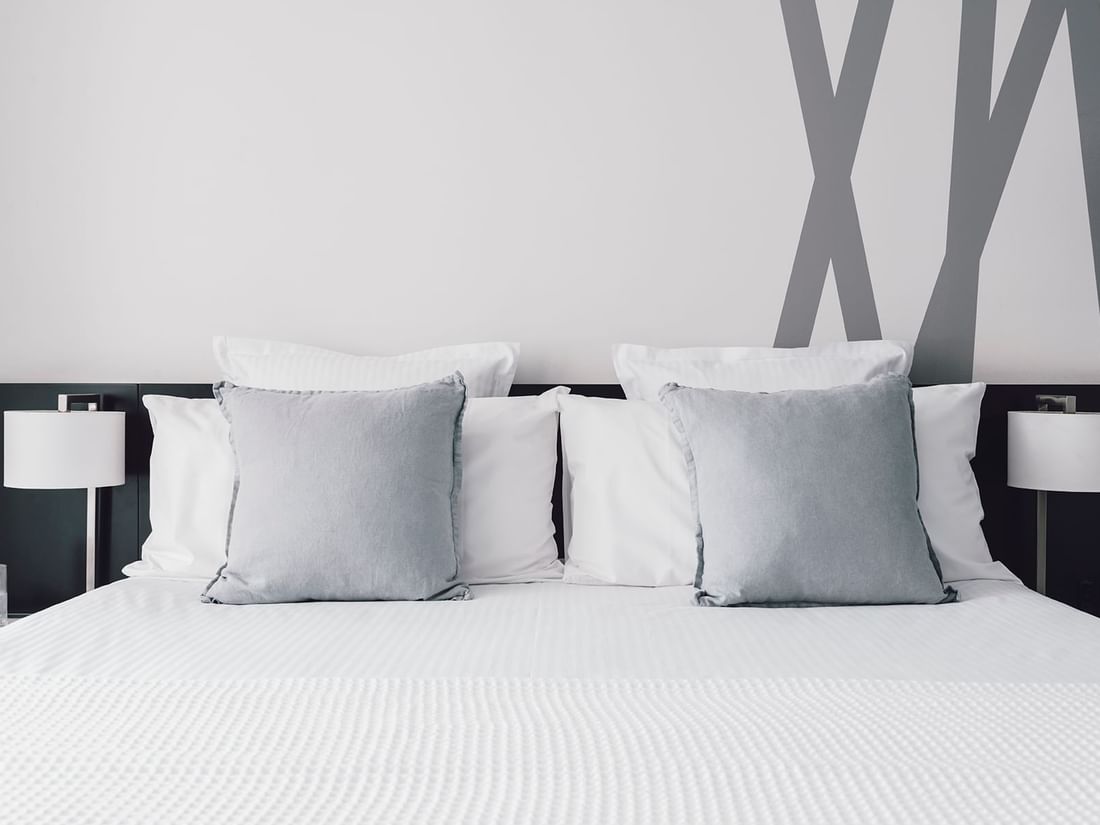 Pillows on the bed in 2 Bedroom 2 Bathroom Deluxe Apartment with City & River Views at Quay West Suites Melbourne