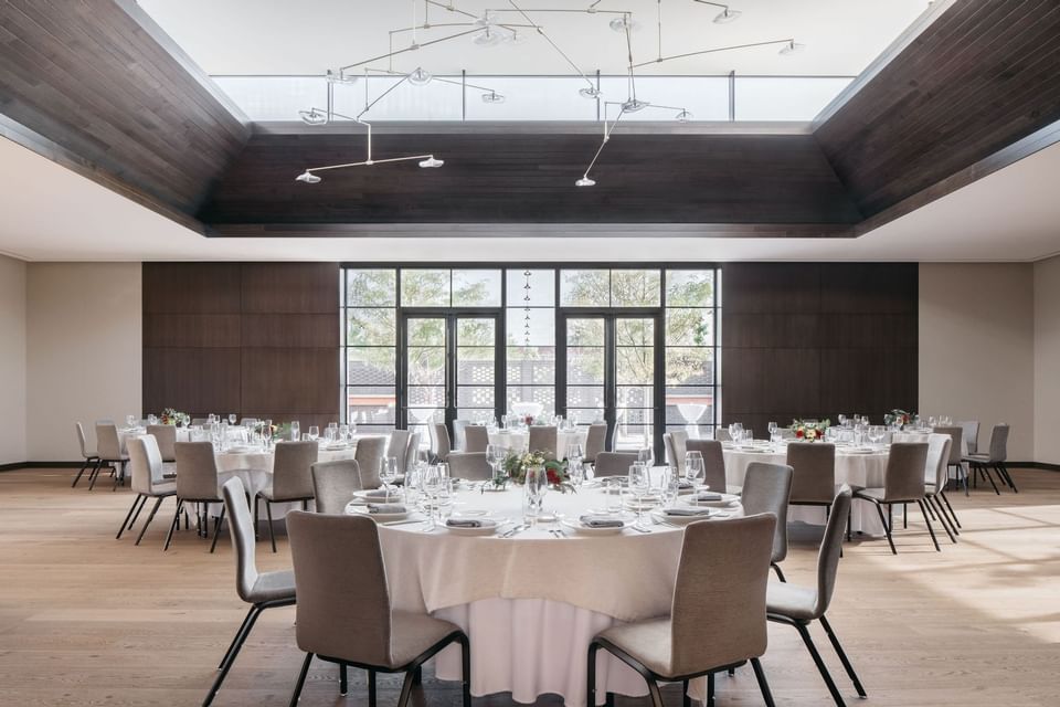 Winter Garden with banquets setting and atrium windows in The Study at the University of Chicago