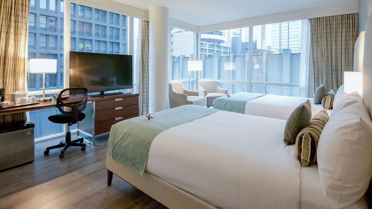 double bed with tv and sofa chair