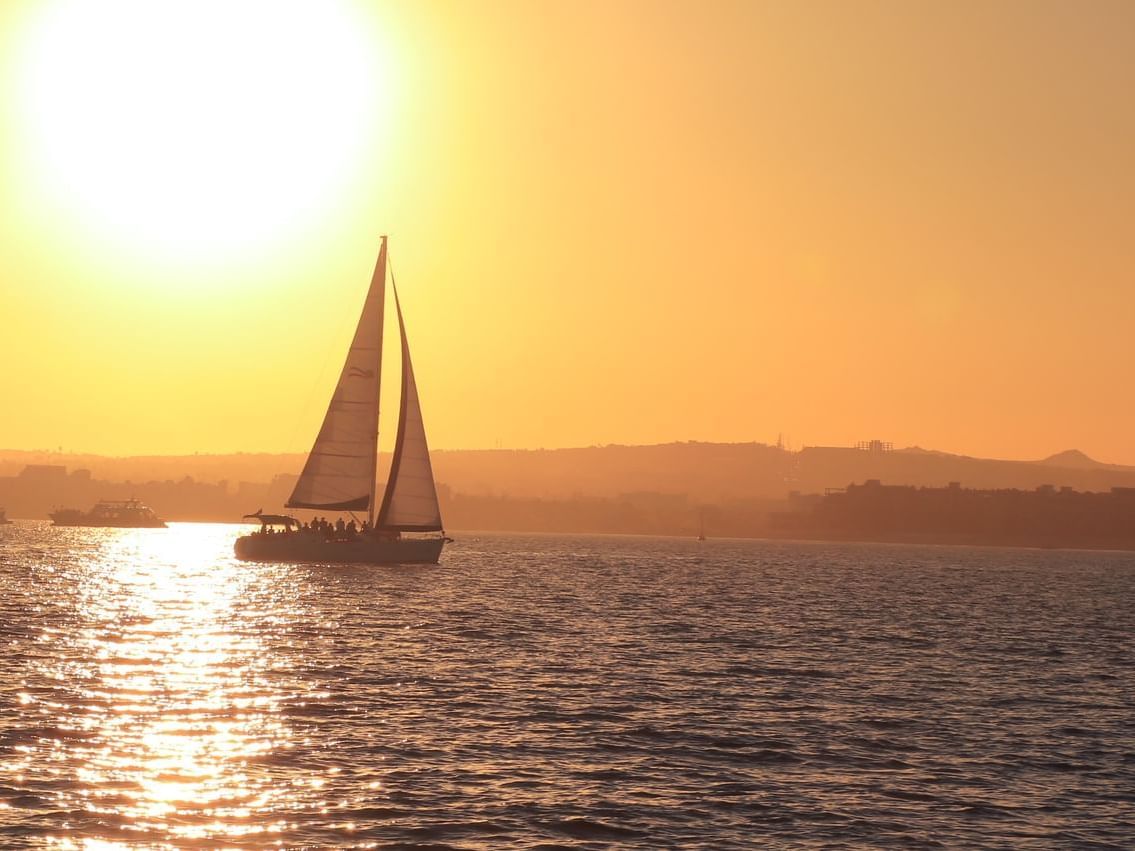 Sailing boat on sunset at Cabo