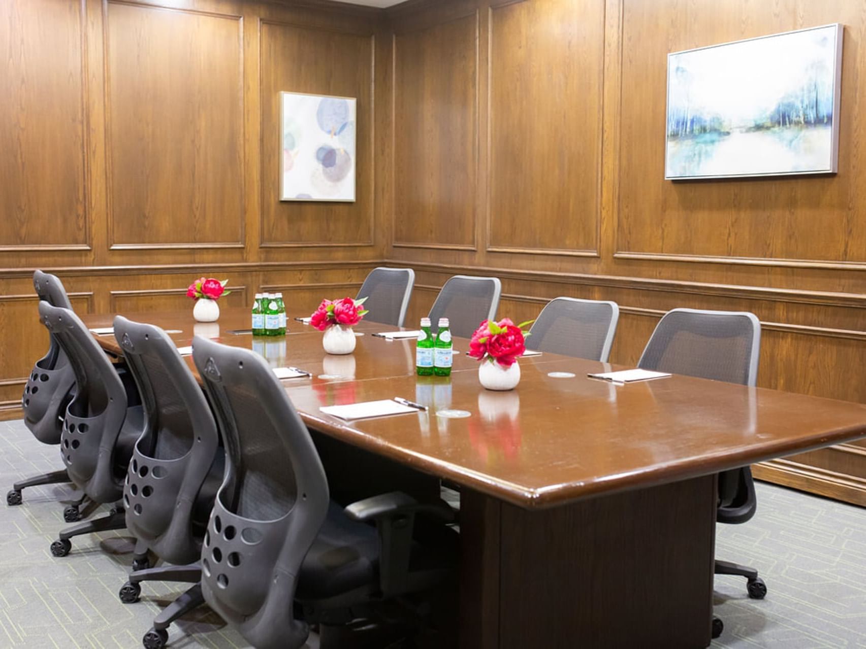 The elegant Oak boardroom at The Park Hotel London, with a polished table and wood-paneled walls