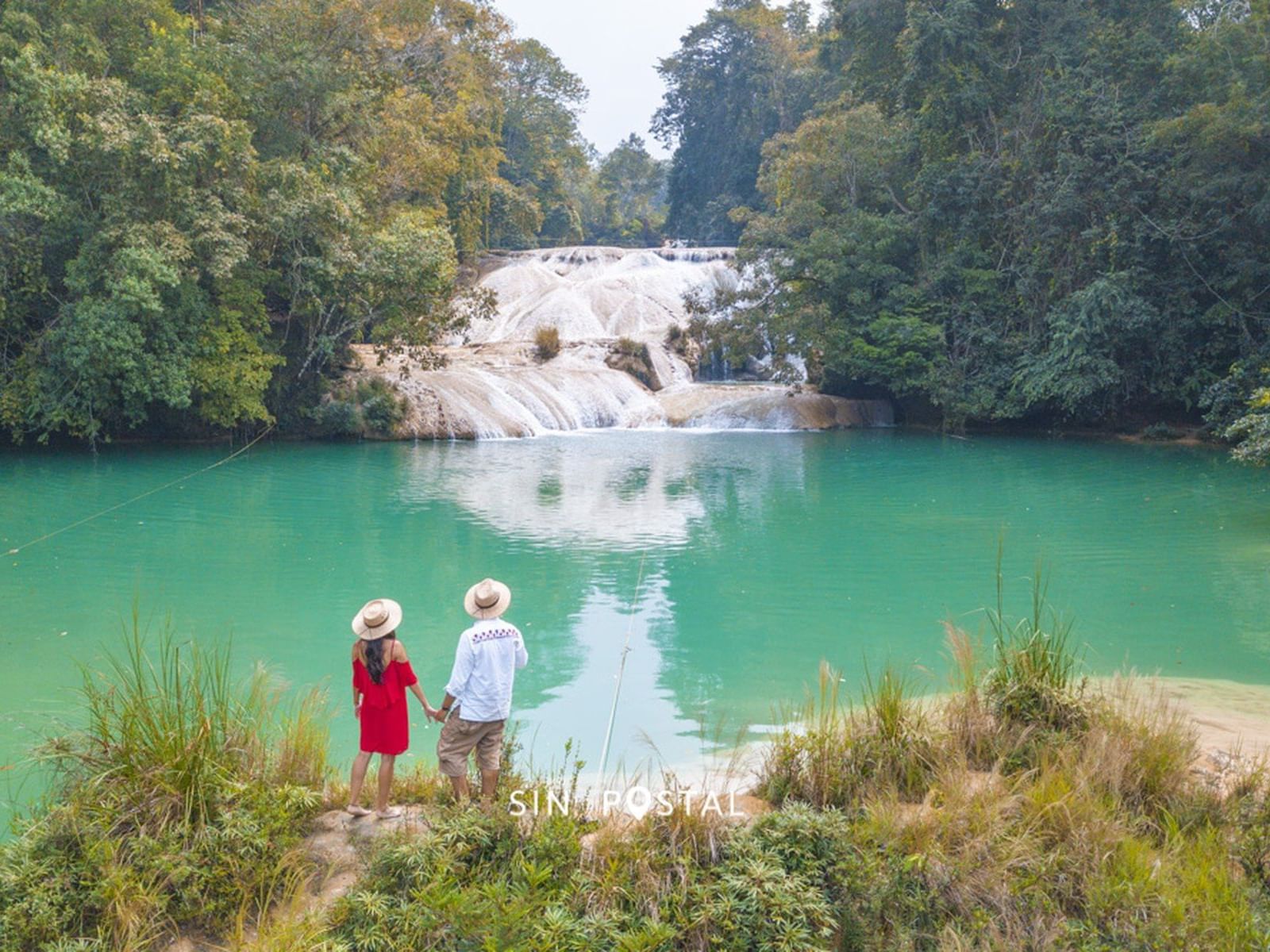 a couple watching a waterfall