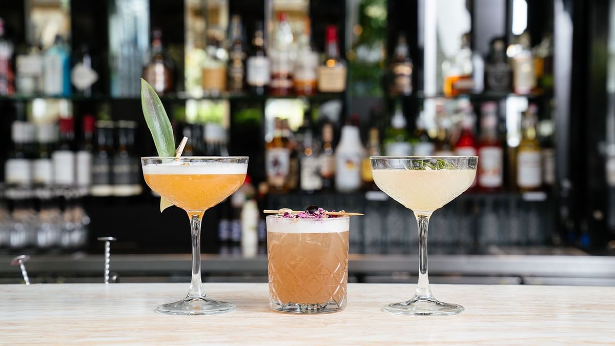Cocktails on a bar counter with garnishes in Lobby Lounge at Crown Metropol Perth