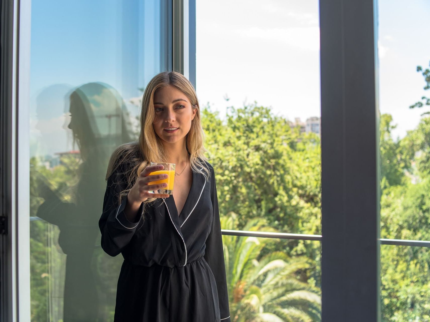 Woman enjoying her juice at Hotel Ismael