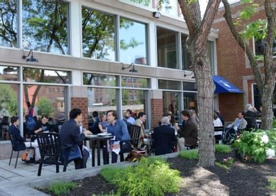 Exterior view of the outdoor dining area at UMass Lowell Inn