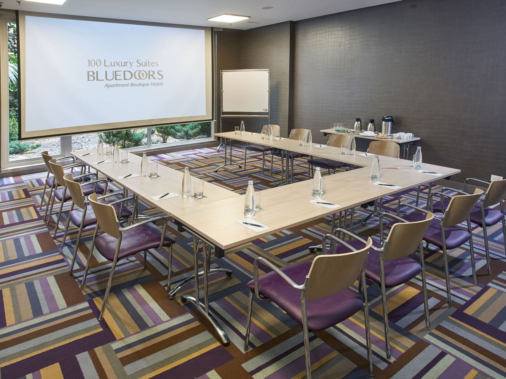 U-shaped table arranged in a meeting room at Blue Doors Hotels