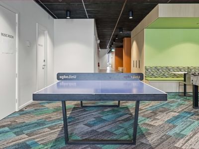 Ping pong table in colorful lounge area at Mayoral Drive Student Accommodation.