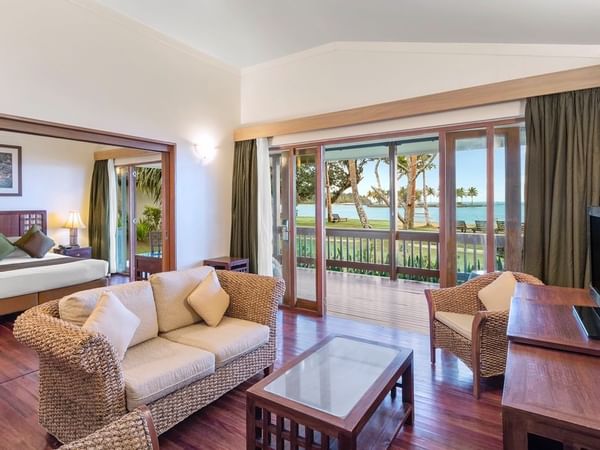 Bedroom & lounge area in One-Bedroom Villa at Naviti Resort