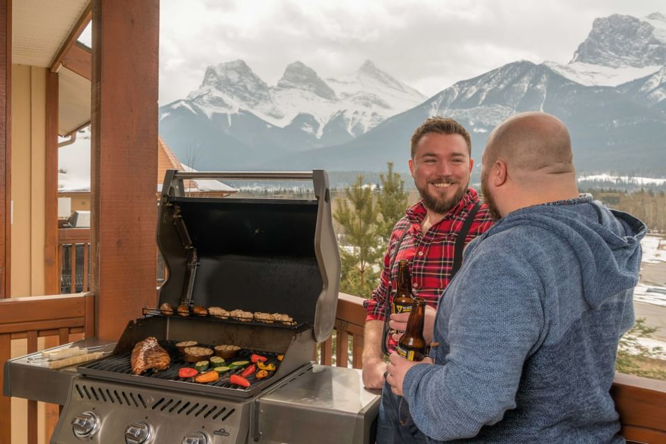 2 friends cooking BBQ at Falcon Crest Lodge