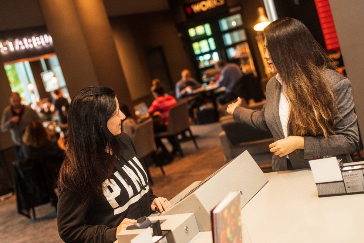 Portrait of 2 girls friendly talking at Village Hotel Edinburgh