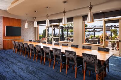 Table with TV in meeting room at Manteo Resort Waterfront