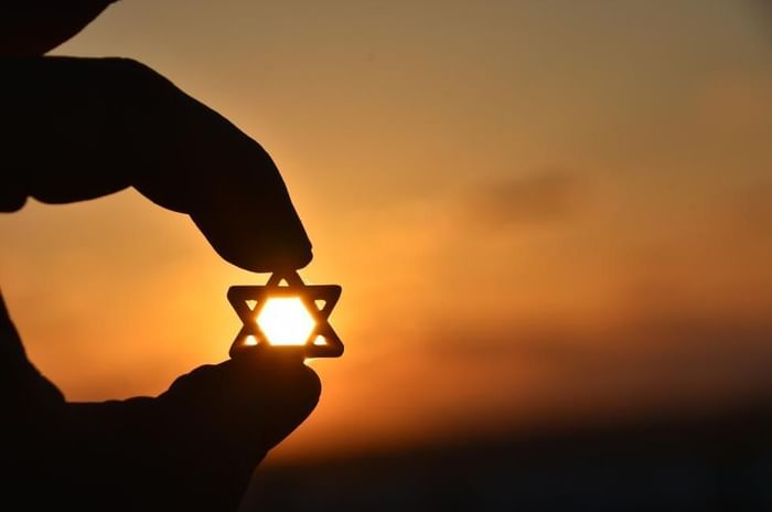 Jewish weddings in Berkshire featuring a star of David against a sunset