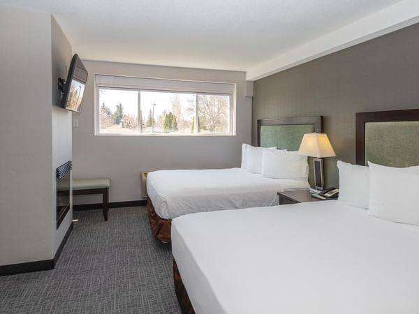 Two queen beds and a TV