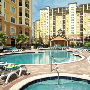 Outdoor pool area with sun loungers at Lake Buena Vista Resort Village & Spa