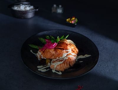 Close-up of a Teriyaki Salmon dish served at Amsterdam Manor
