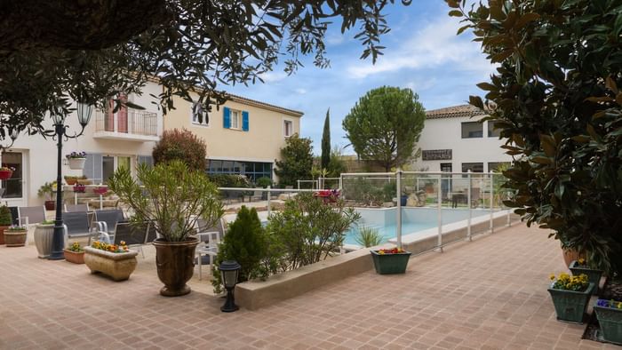 View of the outdoor pool at Hotel Le Village Provencal