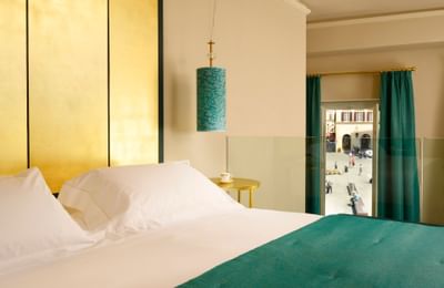 Queen size bed at Grand Hotel Minerva