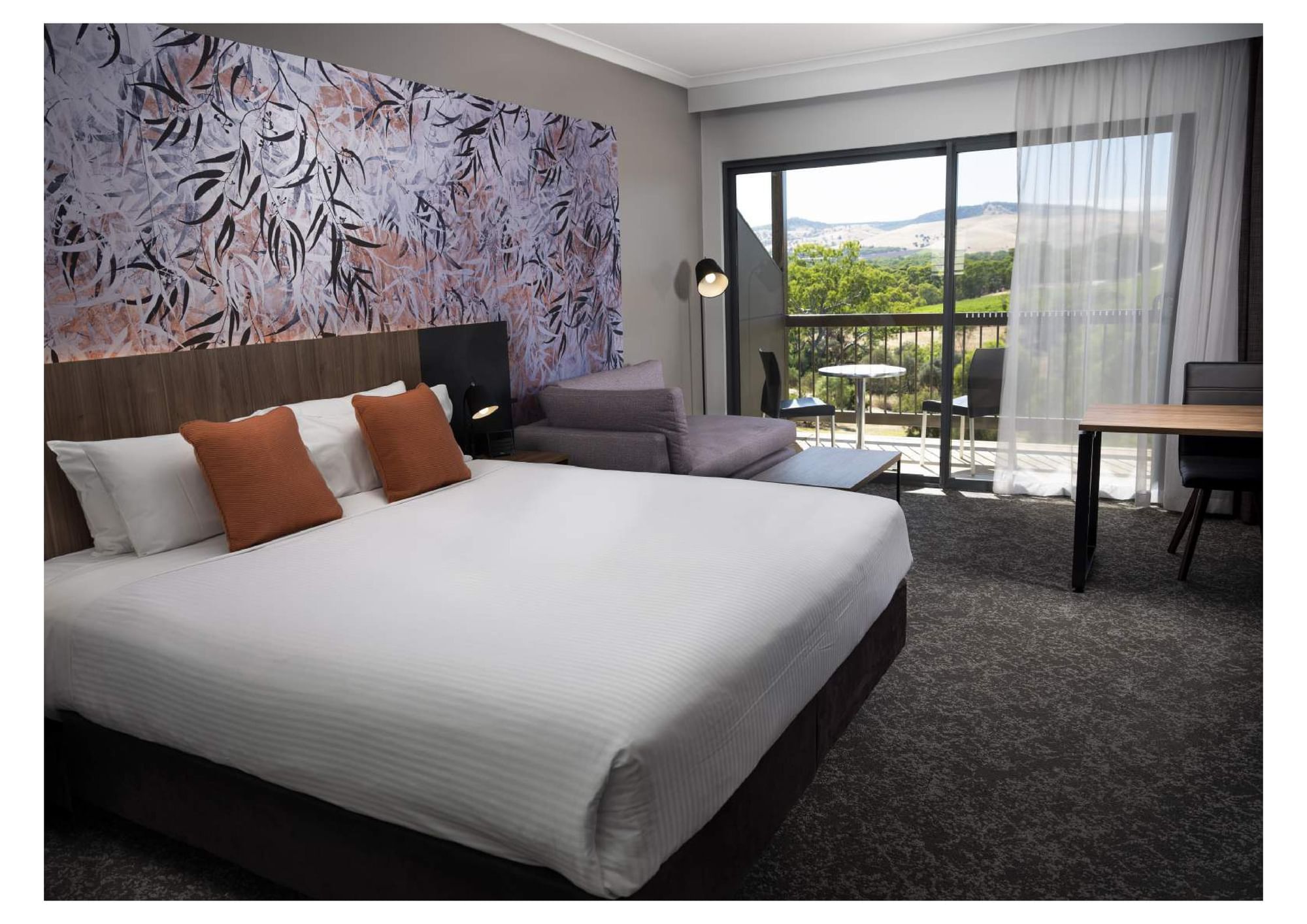 Interior of Comfy bedroom with a balcony at Novotel Barossa