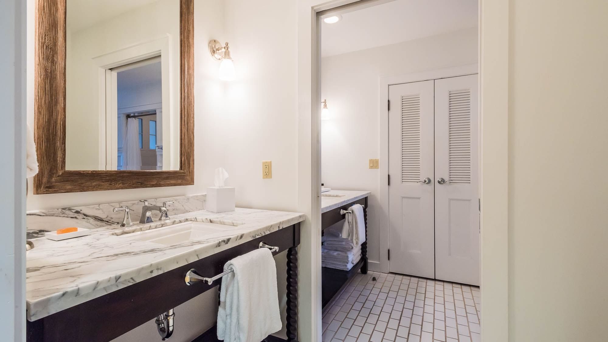 Marbled vanity area in the Resort suite bathroom at Watersound Inn