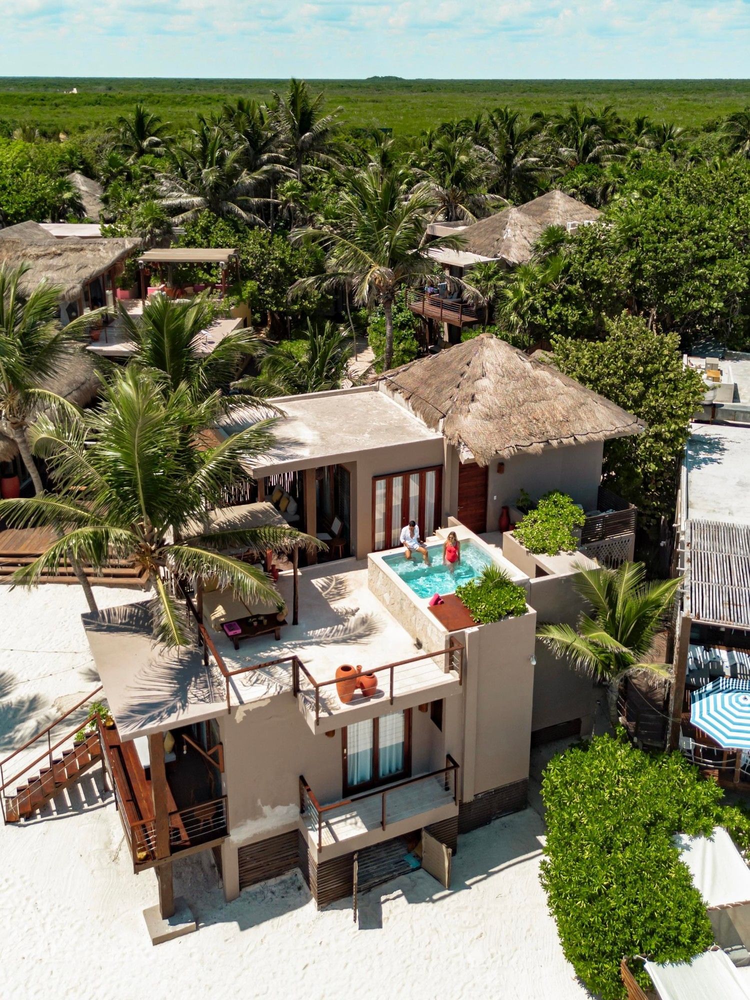 Aerial view of a luxurious beachfront suite at La Zebra Hotel with a private rooftop terrace and plunge pool.