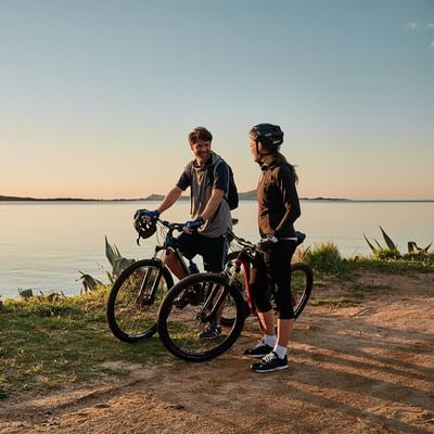 A couple on a mountain bike riding near Falkensteiner Hotels