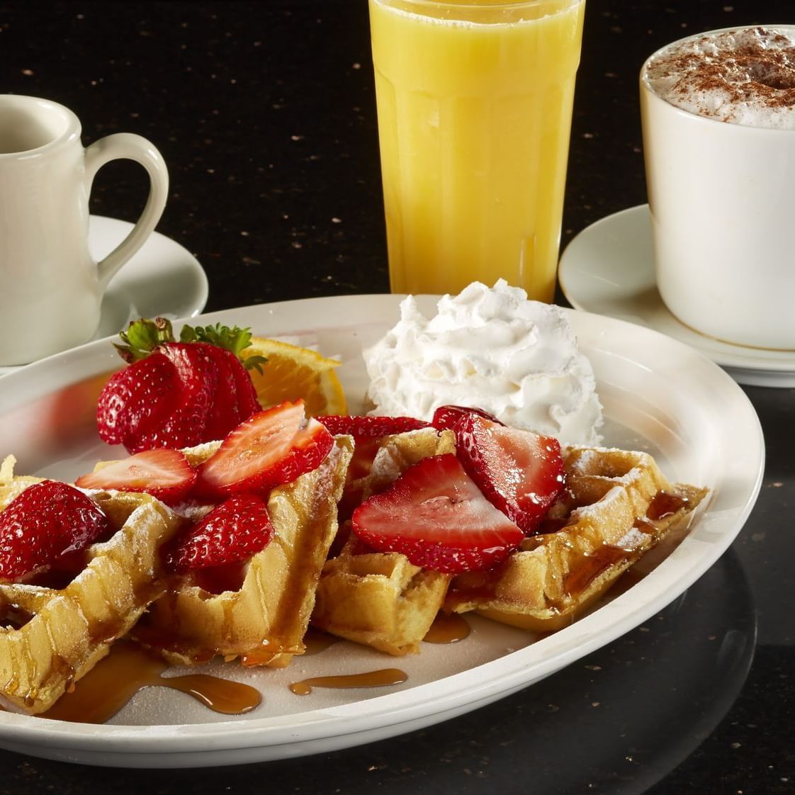 Close up of waffles served with tea at Flamingo Express Hotel