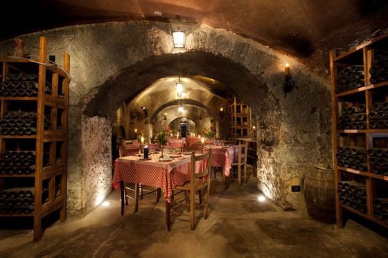 Cozy restaurant nestled in a cave in Bettoja Wine Cellar at Bettoja Hotel Mediterraneo