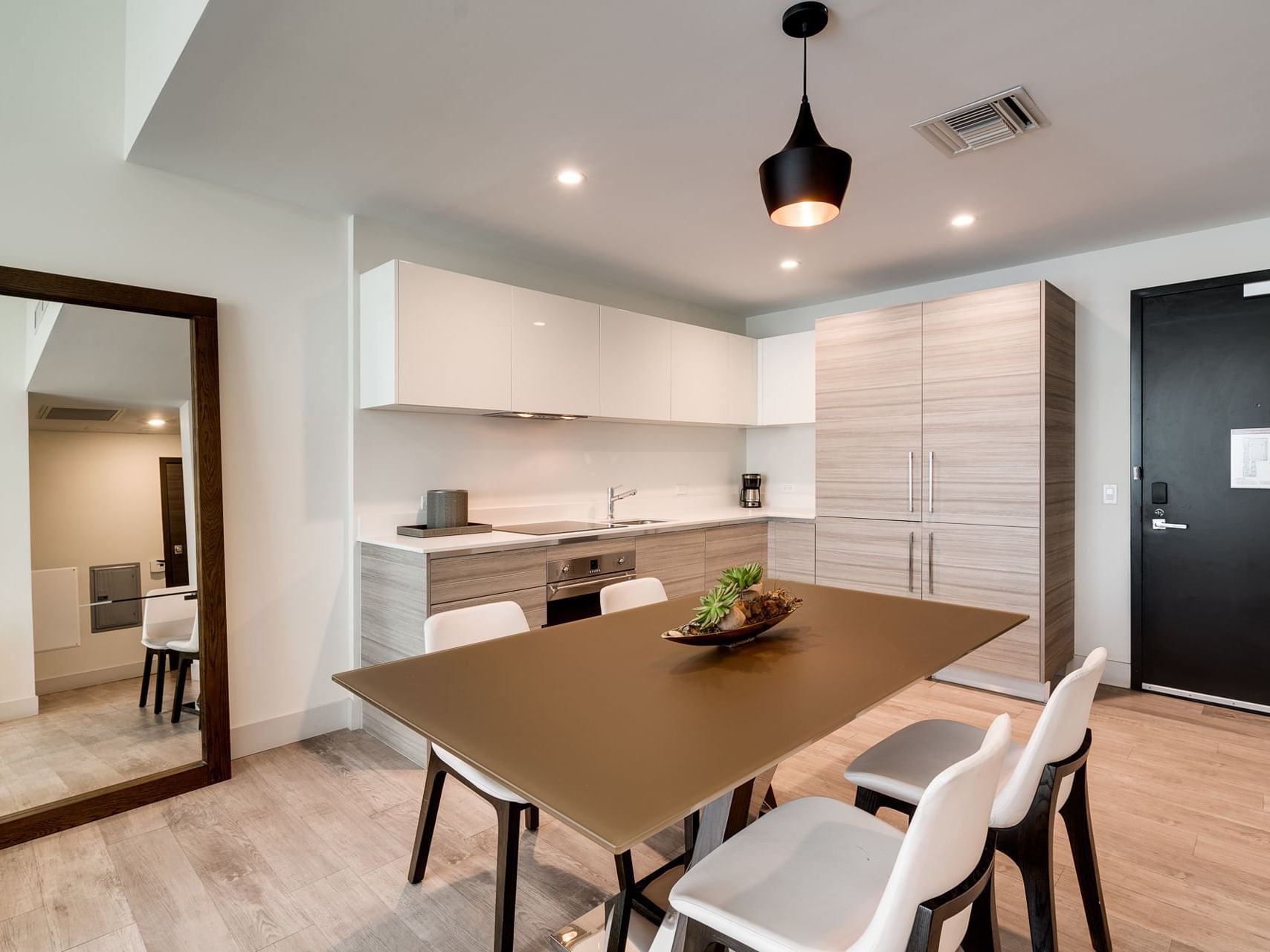 Dining table in One Bedroom Suite King at Costa Beach Resort 