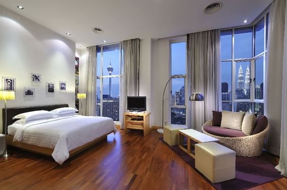 Interior of room with king bed at Federal Hotels International