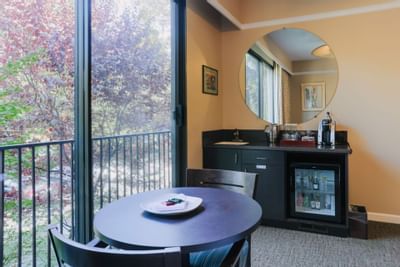 Table in Deluxe Room with Two Beds at Dinah's Garden Hotel