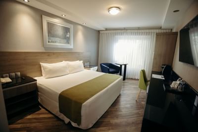 King bed, TV & desk in Master suite at Araiza Hotel Hermosillo
