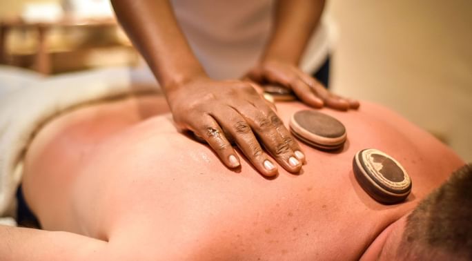 A man getting a massage in a spa at Zanzibar Serena Hotel