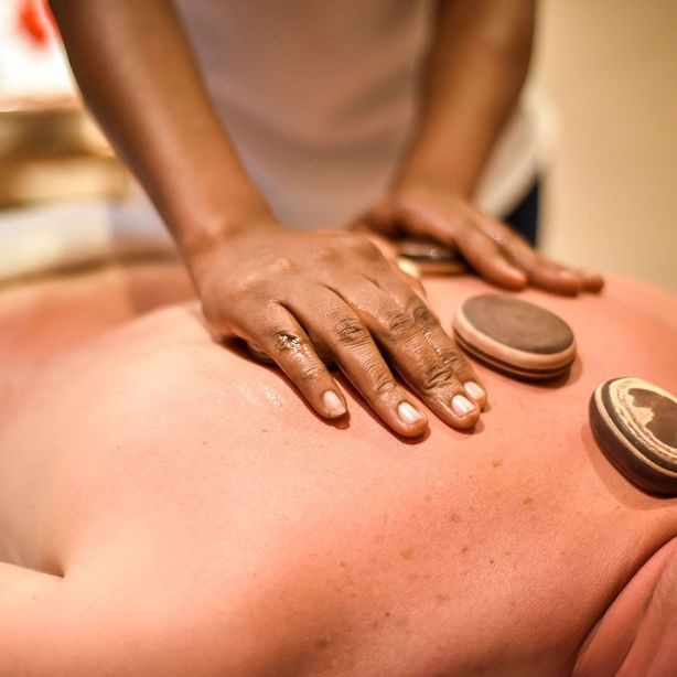 A man getting a massage in a spa at Zanzibar Serena Hotel