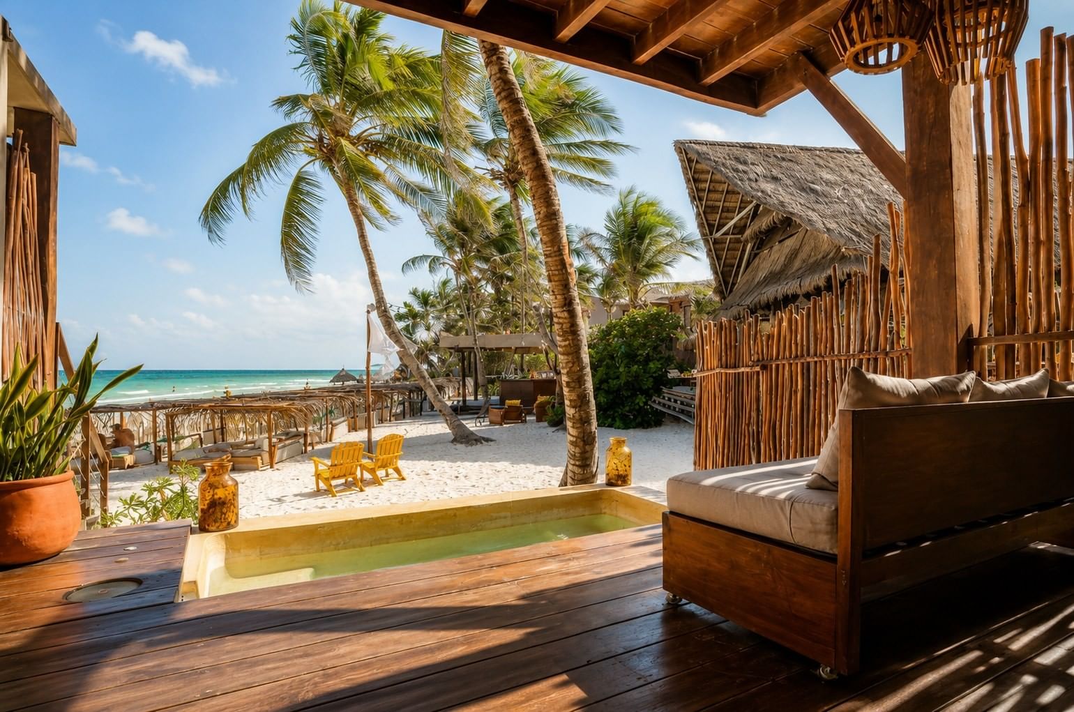 A private plunge pool and shaded terrace overlooking the beach at La Zebra in Tulum.