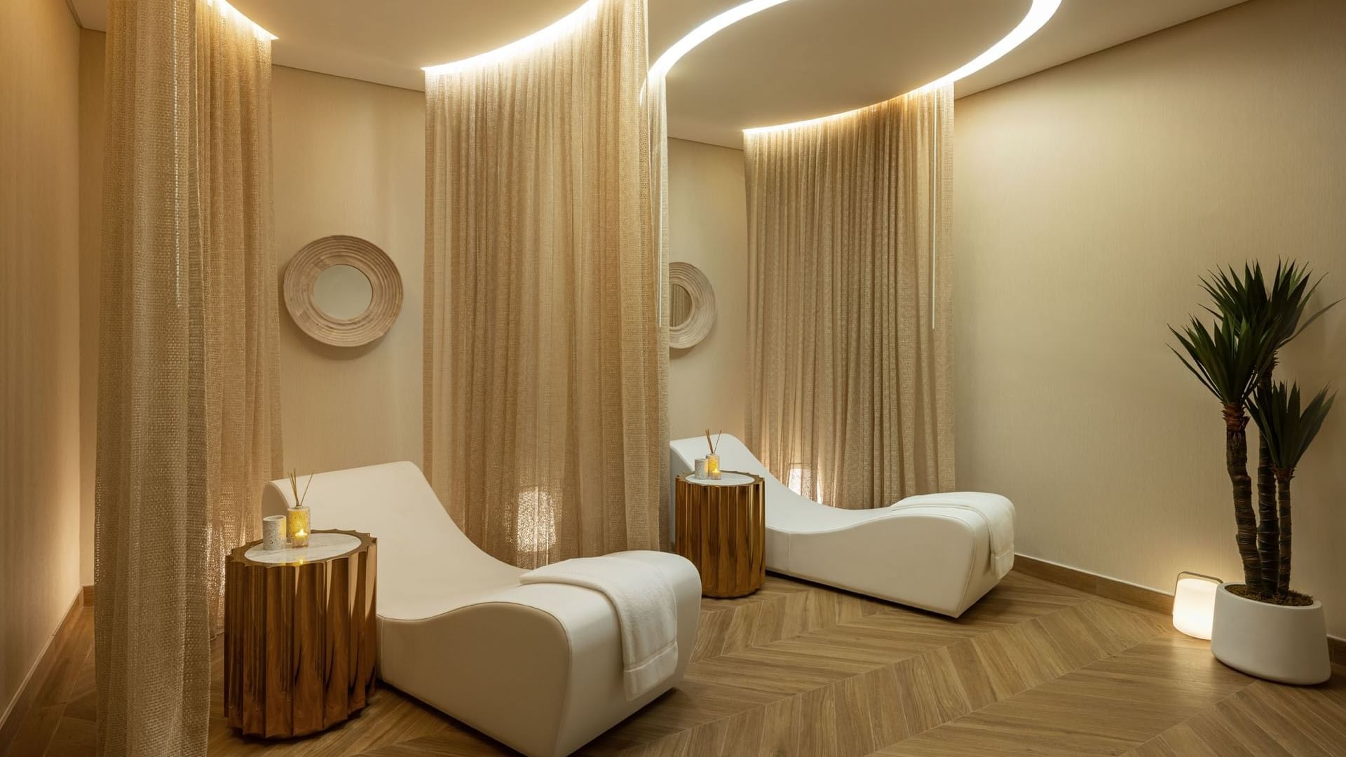Two loungers in the luxury spa with wooden floors at DAMAC Maison Aykon City Hotel Apartments