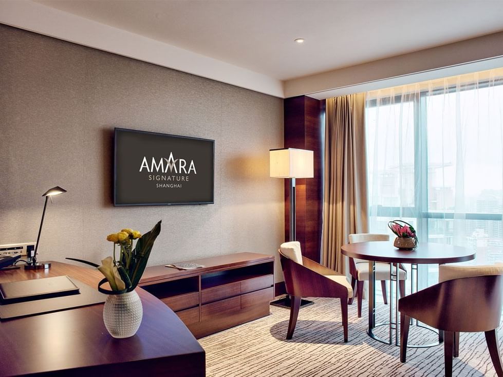 Living area & desk in the Amara deluxe suite at Amara Hotel