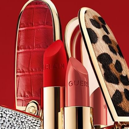 Luxury lipsticks with animal print and red leather textures on a red background at The Milner York