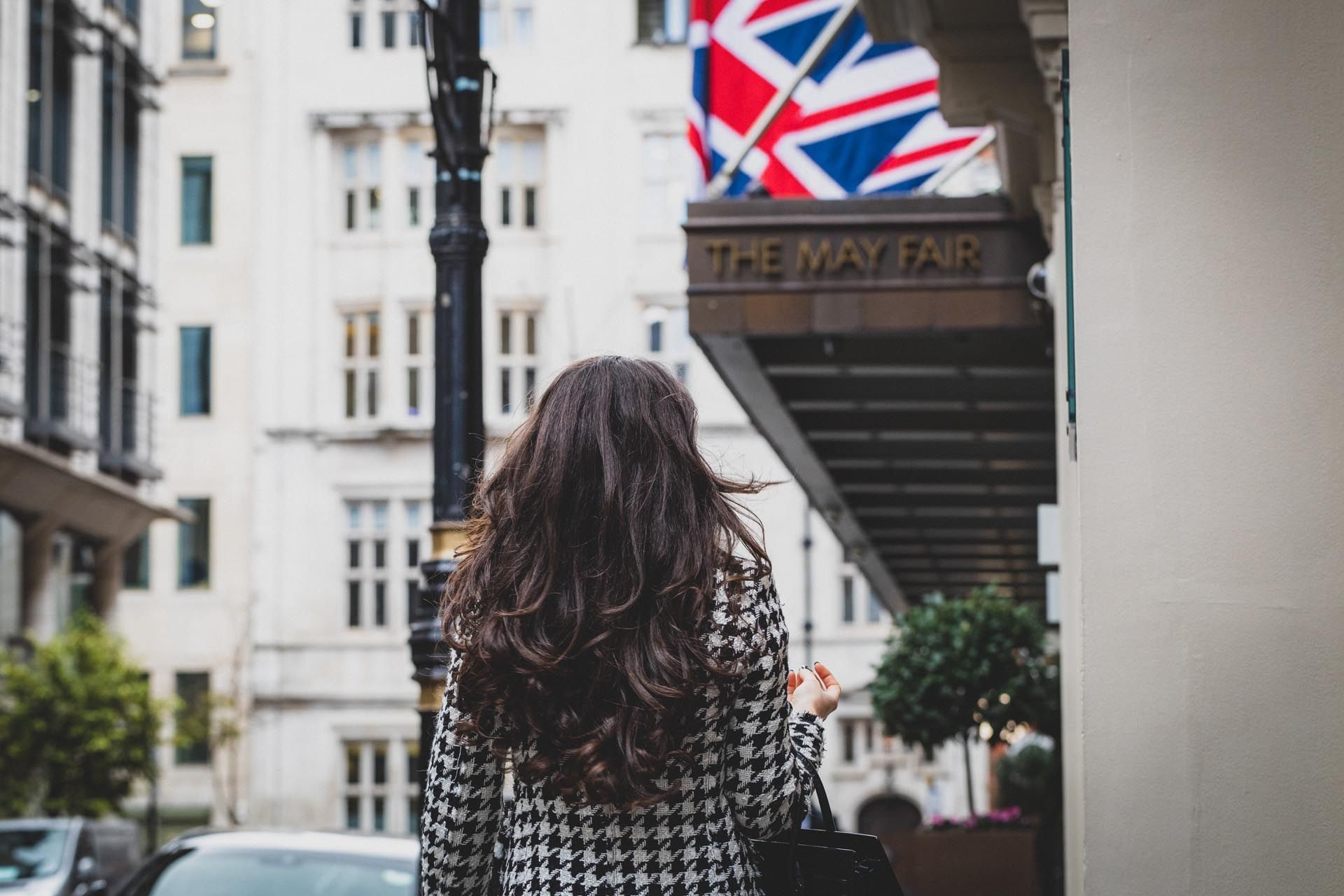 Close up of a girl walking near The May Fair Hotel London