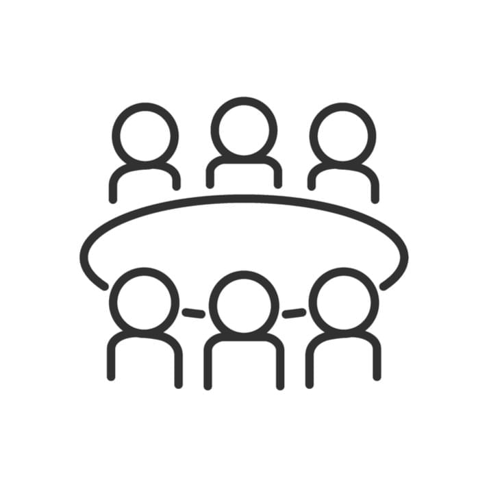 Line drawing of six people seated around a round table with three on each side.