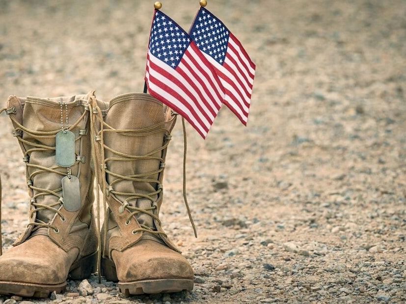 Military combat boots with the American flag & dog tags at Paradise Bay Resort