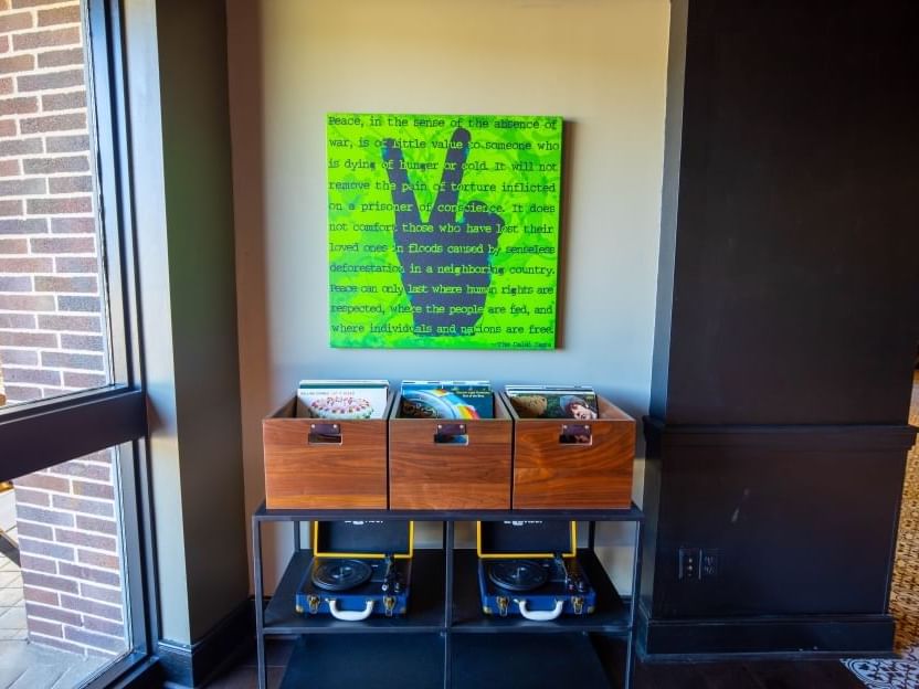 records and a record player under a peace sign